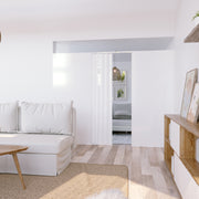 modular partition wall with accordion door in modern Scandinavian house design with white couch and natural wood accents