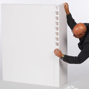 photo of man installing finishing caps in everpanel modular wall system