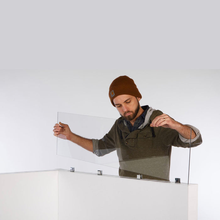 a man placing glass in everpanel window