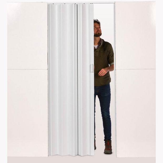 man fitting blinds in wall mount L shaped room divider door